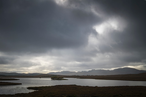 An autumnal HDR NC500 image of dark foreboding clouds over Clar-loch Mor in Sutherland, northern Scotland