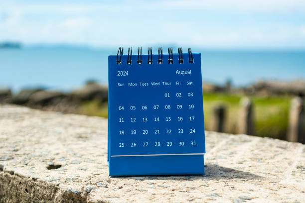 istock Blue August 2024 calendar on blurred background of blue ocean. 1758082049
