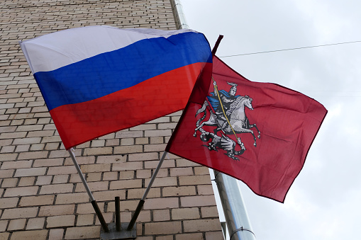 Russian flag and Moscow flag on the wall.