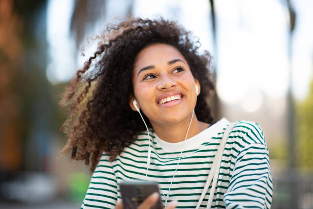 istock sitting with phone and earbuds 1758099181