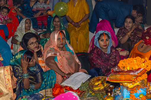 Ghaziabad, Uttar Pradesh, India - October 2022: Chhath Puja, Indian hindu female devotee enjoying the rituals and festival of chhath.