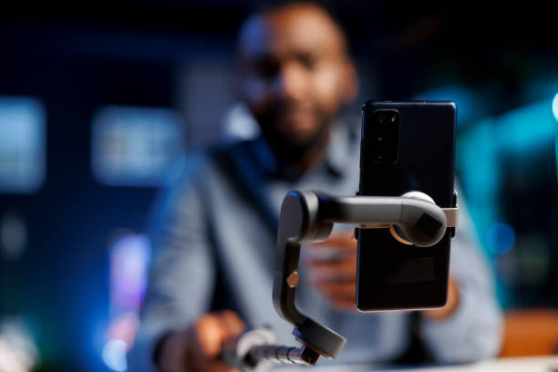 istock Phone on selfie stick used for vlogging 1758108722