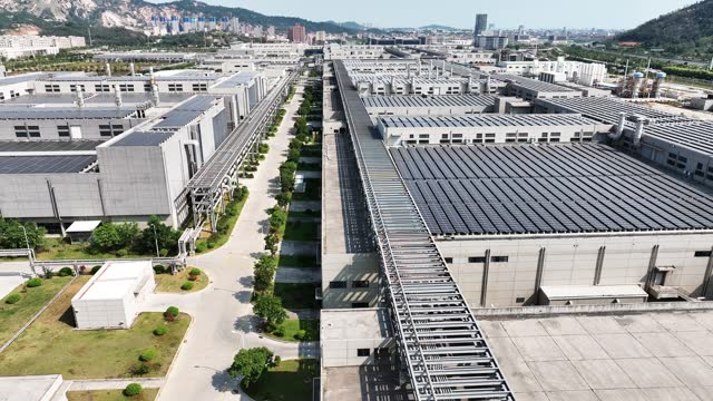 Aerial view of solar power tiles on factory roof