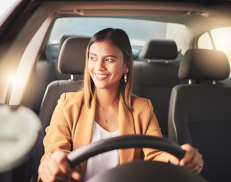 Smile, driving and business woman in car to travel, journey or thinking of transportation in city. Happy, driver and person in motor vehicle, automobile or road trip to commute to work in the morning