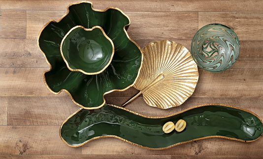 decorative assemblies seen from above with plates, bowls and objects with fruits and vegetables