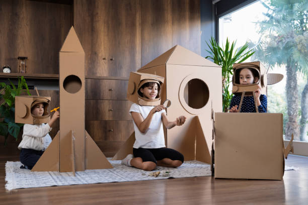 istock Children playing role play game as astronauts on mars. 1758149752