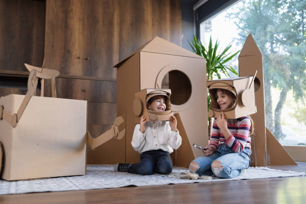 istock Children playing role play game as astronauts on mars. 1758155896