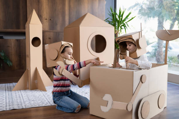 istock Children playing role play game as astronauts on mars. 1758163574