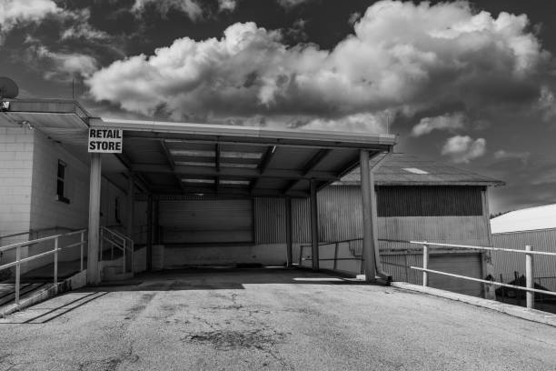 istock Black and white photo of warehouse loading dock 1758165304