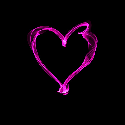 The abstract heart is transparent, bright and airy pink. Element on a black background