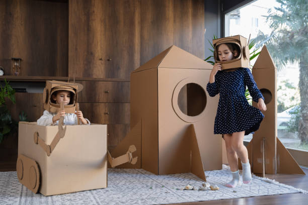 istock Children playing role play game as astronauts on mars. 1758171537