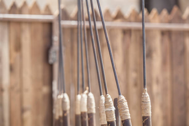 Stand full of pila or roman javelins at military camp Stand full of pila or roman javelins at military camp. Perimeter palisade as background pila stock pictures, royalty-free photos & images