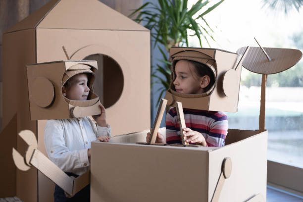 istock Children playing role play game as astronauts on mars. 1758175018