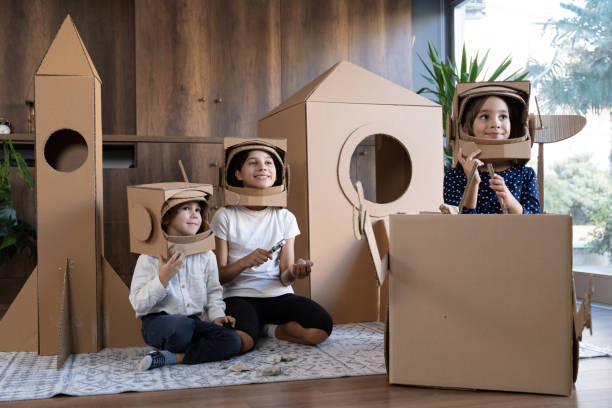 istock Children playing role play game as astronauts on mars. 1758186568