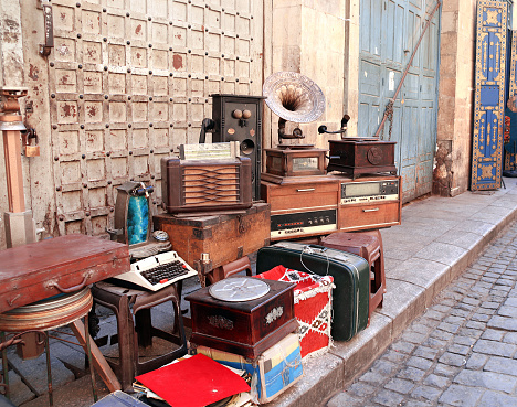 Vintage and antique objects - gramophone, typewriter, telephone, at the flea market on Khan Al-Khalili Bazaar, Cairo, Egypt