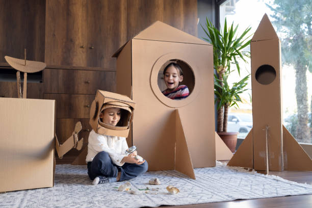 istock Children playing role play game as astronauts on mars. 1758188238