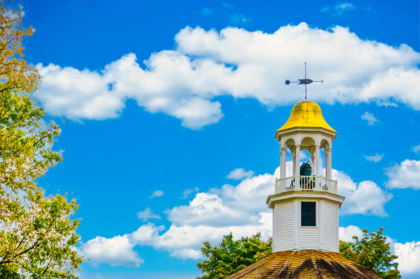 A directional arrow  on a weathervane points the wind direction atop the Old Round Church in Richmond, Vermont.