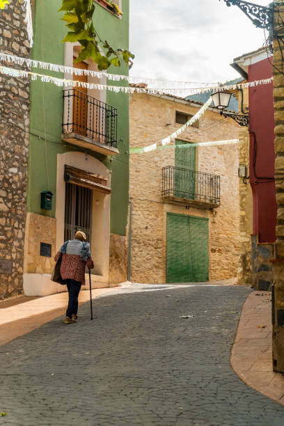 istock Granny walking by the old town. 1758193178