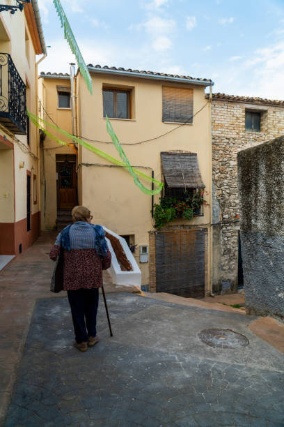 istock Granny walking by the old town. 1758193188