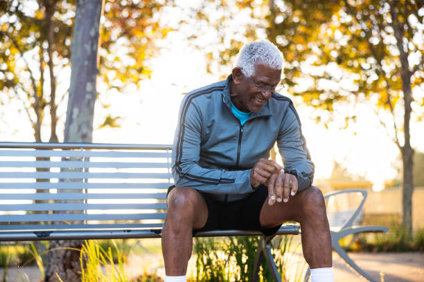 istock Senior black man checking his smart watch biometric data during a workout 1758198820