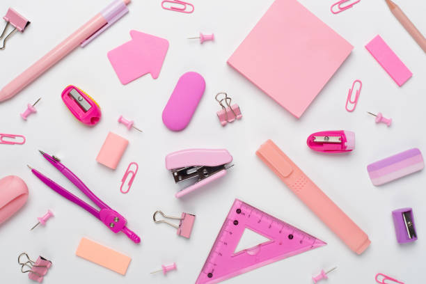 istock Pink school stationery on color backgroung, top view 1758200452