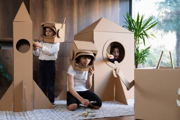 istock Children playing role play game as astronauts on mars. 1758201585