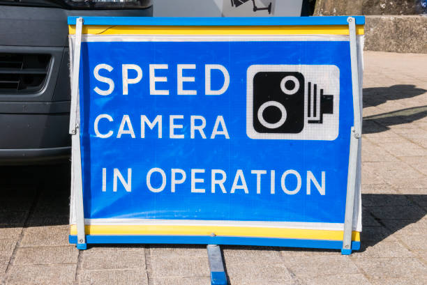 Sign warning of a Speed camera detector van.