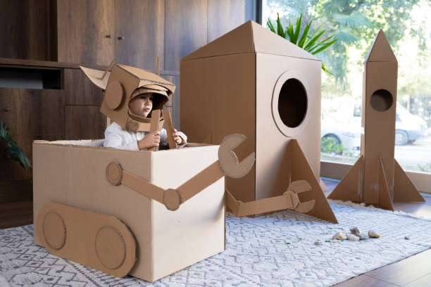 istock Child Boy playing role play game as an astronauts on mars. 1758211576