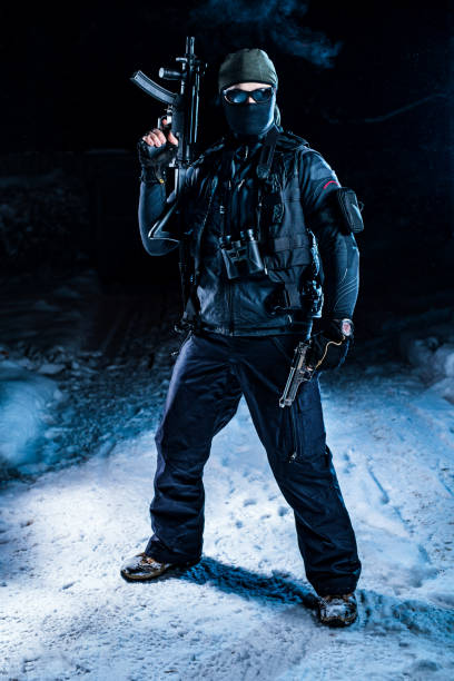 istock Military man winter posing at night 1758225113
