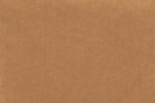 Brown wrinkled Christmas or holiday wrapping paper background or textures with copy space.