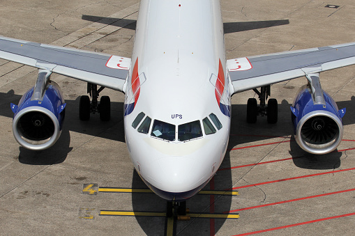 Düsseldorf, Germany - June 7, 2014: British Airways Airbus A319-100 with registration G-EUPS on the ramp of Düsseldorf Airport.