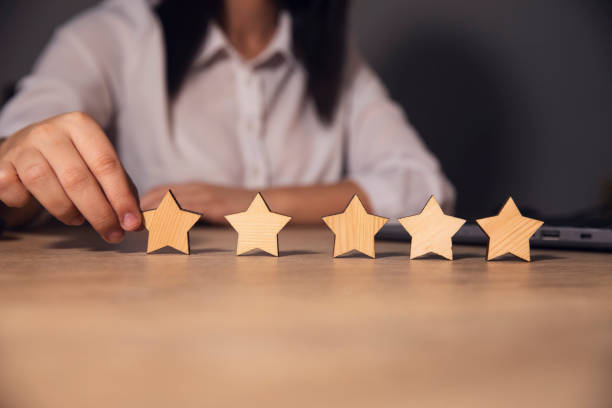 istock rating concept. hand holding star rating icon 1758308450