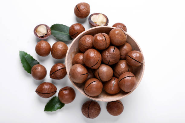 istock Delicious organic Macadamia nuts on white background, flat lay 1758319212