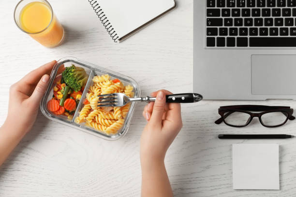 istock Office employee having business lunch at workplace, top view 1758327967