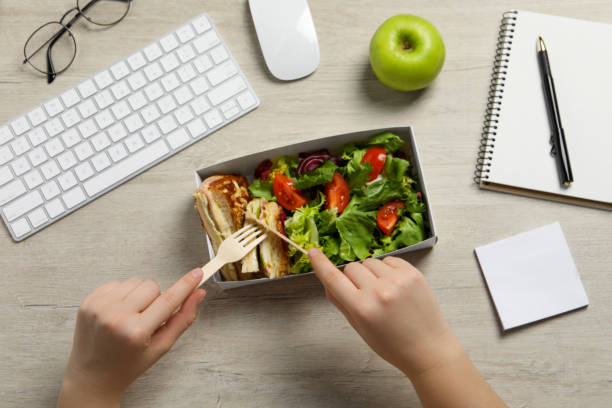 istock Office employee having business lunch at workplace, top view 1758329271