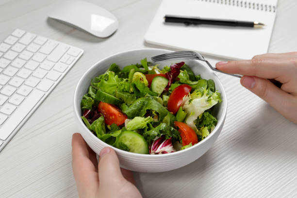 istock Office employee having business lunch at workplace, closeup 1758329416