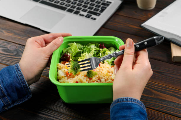 istock Office employee having business lunch at workplace, closeup 1758329597