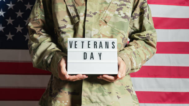 istock USA soldier holding a Veterans day panel on Memorial Day 1758340430