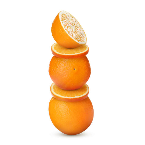 istock Stacked cut and whole oranges on white background 1758342166