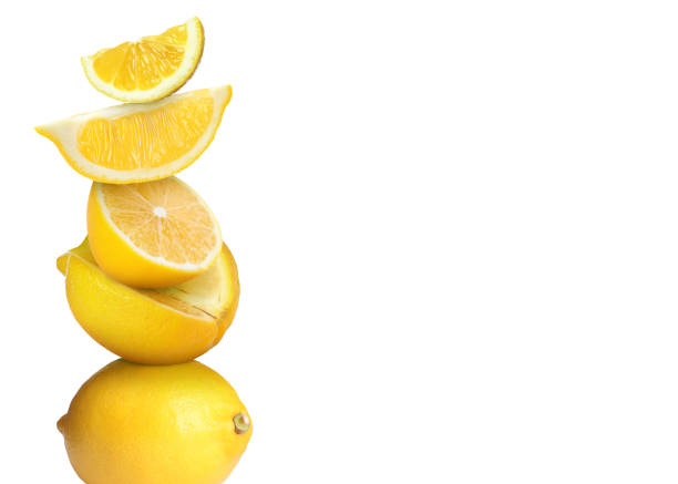 istock Stacked cut and whole lemons on white background 1758342743