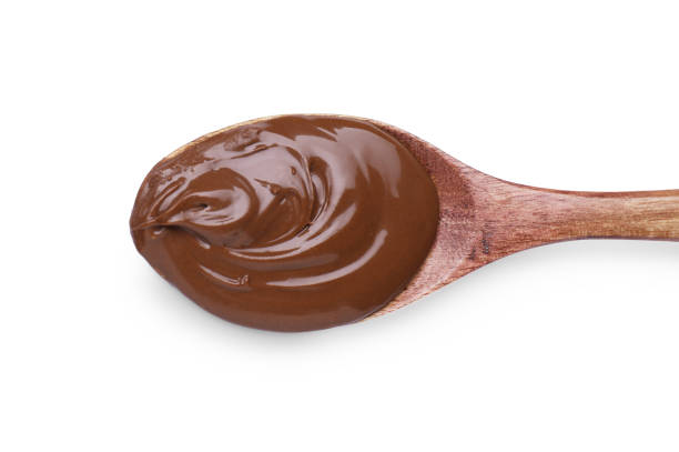 istock Spoon with tasty chocolate paste on white background, top view 1758345446