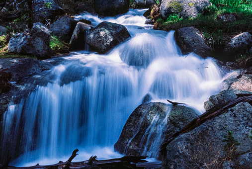 Mountain river cascading over granite river rocks, showing motion.

Taken in Yosemite National Park, California, USA