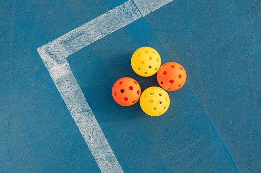 Colorful Pickleball Balls On The Court