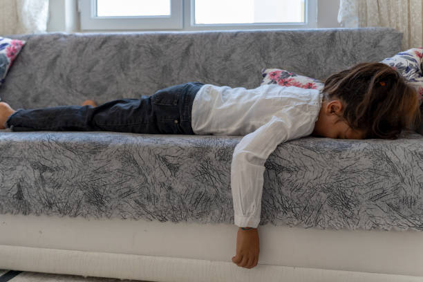 istock A girl lying on the couch. 1758362598