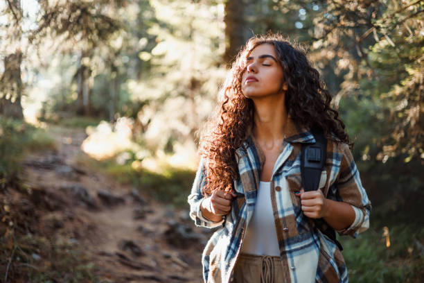 istock Delighted young woman explores mountain trails 1758365854