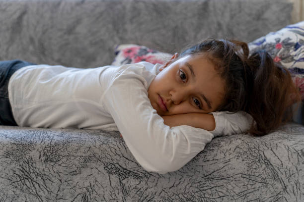 istock A girl lying on the couch. 1758368500