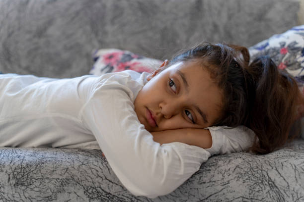 istock A girl lying on the couch. 1758368501