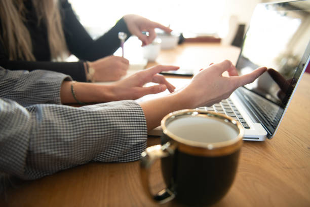 istock Businesswomen discussing project plans during a briefing with coffee 1758369641