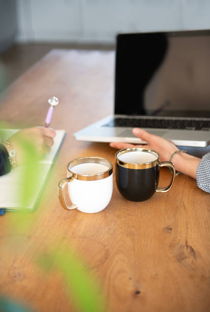 istock Businesswomen discussing project plans during a briefing with coffee 1758369644