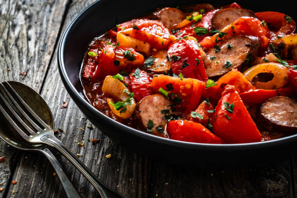 istock Hungarian stew - vegetables with sausages on wooden table 1758372884